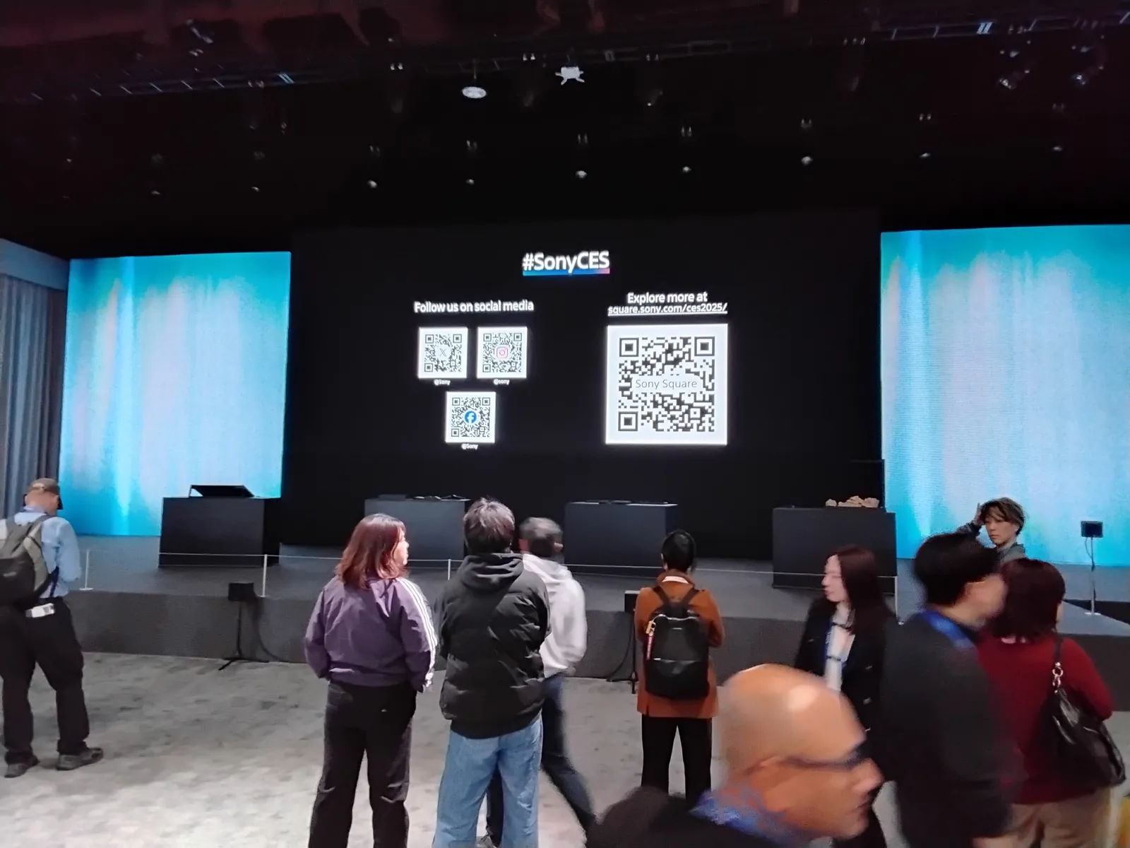 QR code wall on a stage backdrop at Sony's CES 2025 booth in Las Vegas, with codes for its social channels