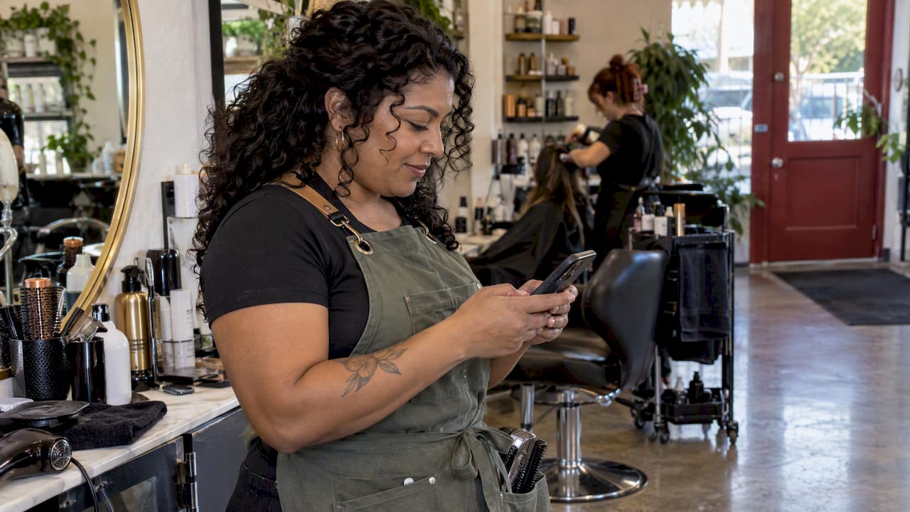 Las Vegas salon owner responding between appointments