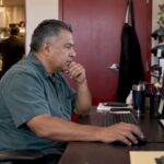 Restaurant owner reviewing an advertising budget